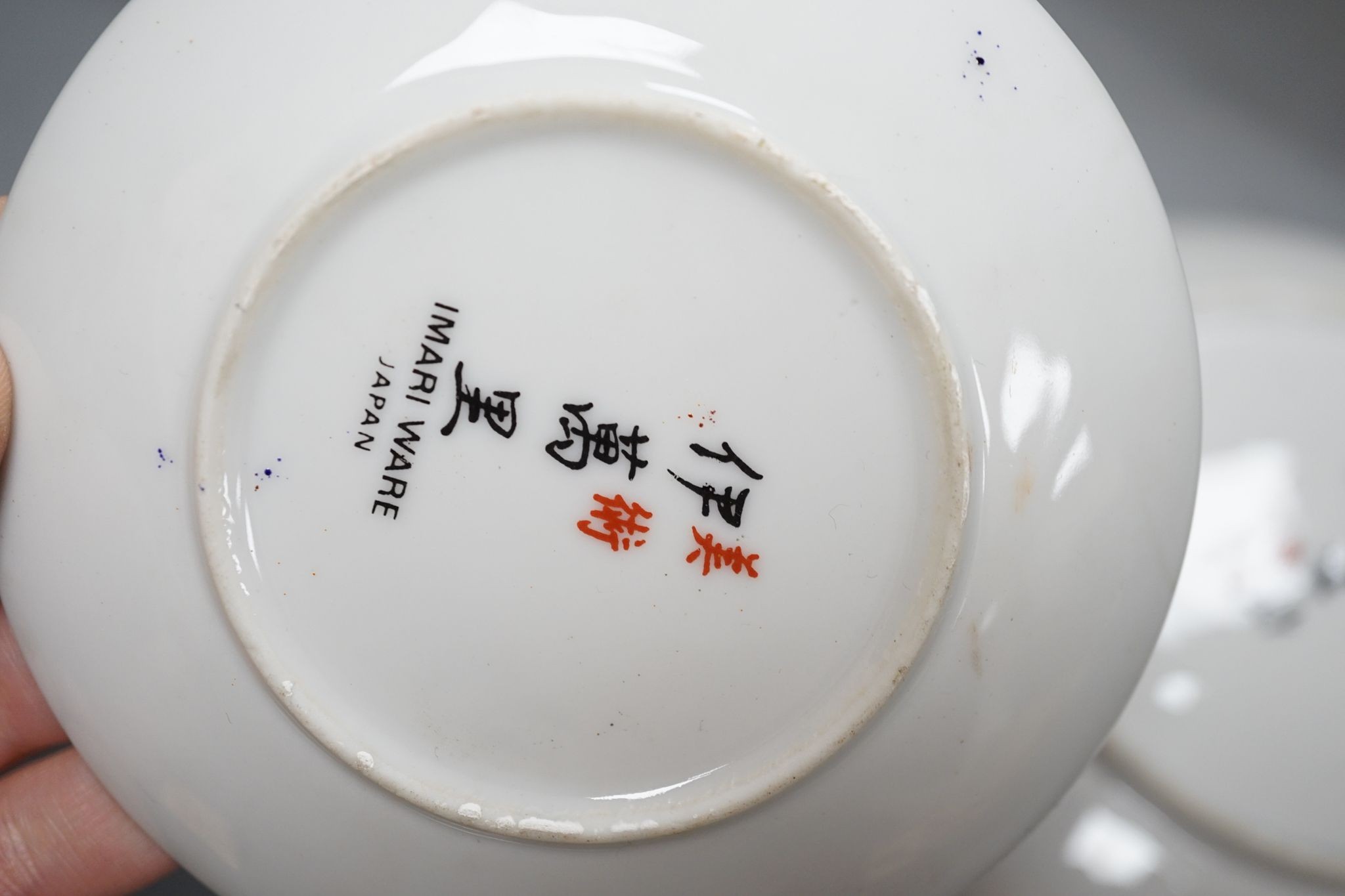 A Royal Crown Derby Imari bowl and two plates and another bowl, 25cm